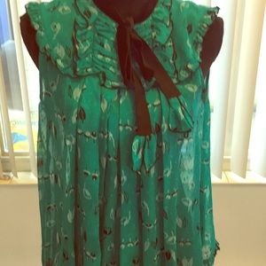 Green silky printed blouse with velvet trim